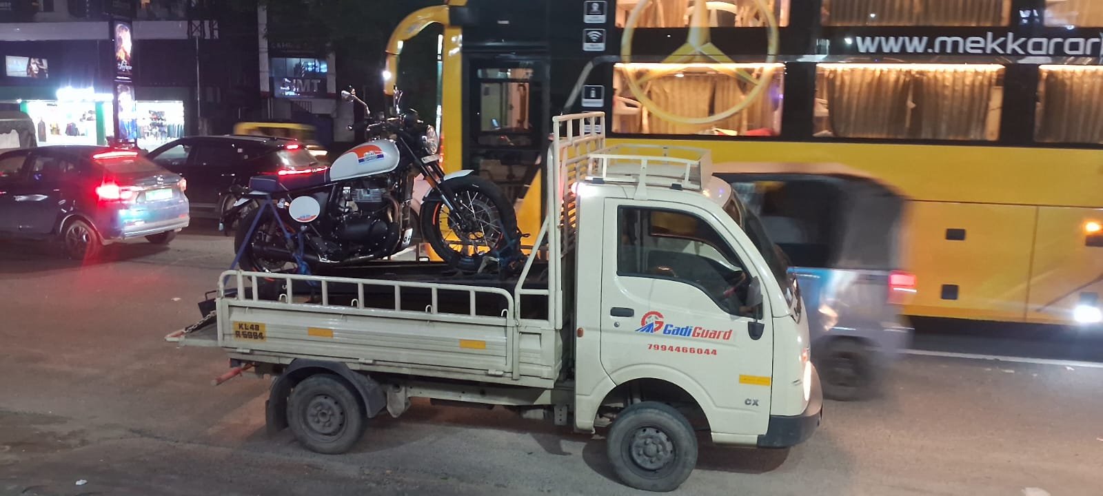 24 Hour Towing Service in Kochi - Night Recovery Van Towing a Bike