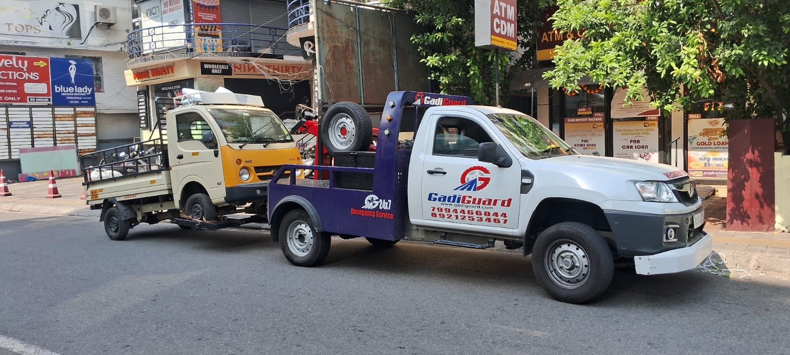 Recovery Van in Kaloor towing a mini truck - Towing Service in Kaloor