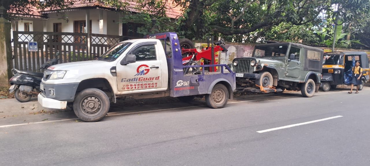 Recovery Van in Palarivattom towing a Mahindra Jeep - Towing Service in Palarivattom